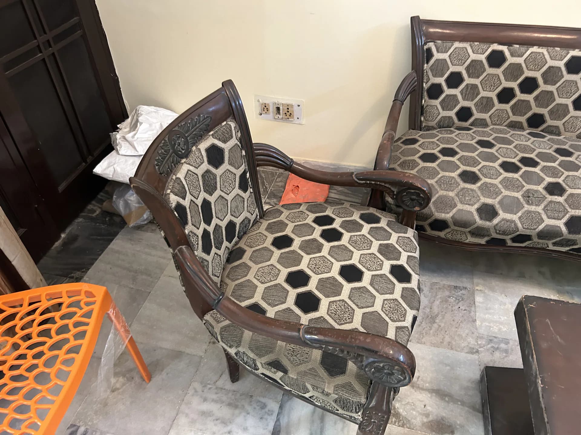 Sofa chair before professional deep cleaning in Delhi — visible dust and staining on fabric